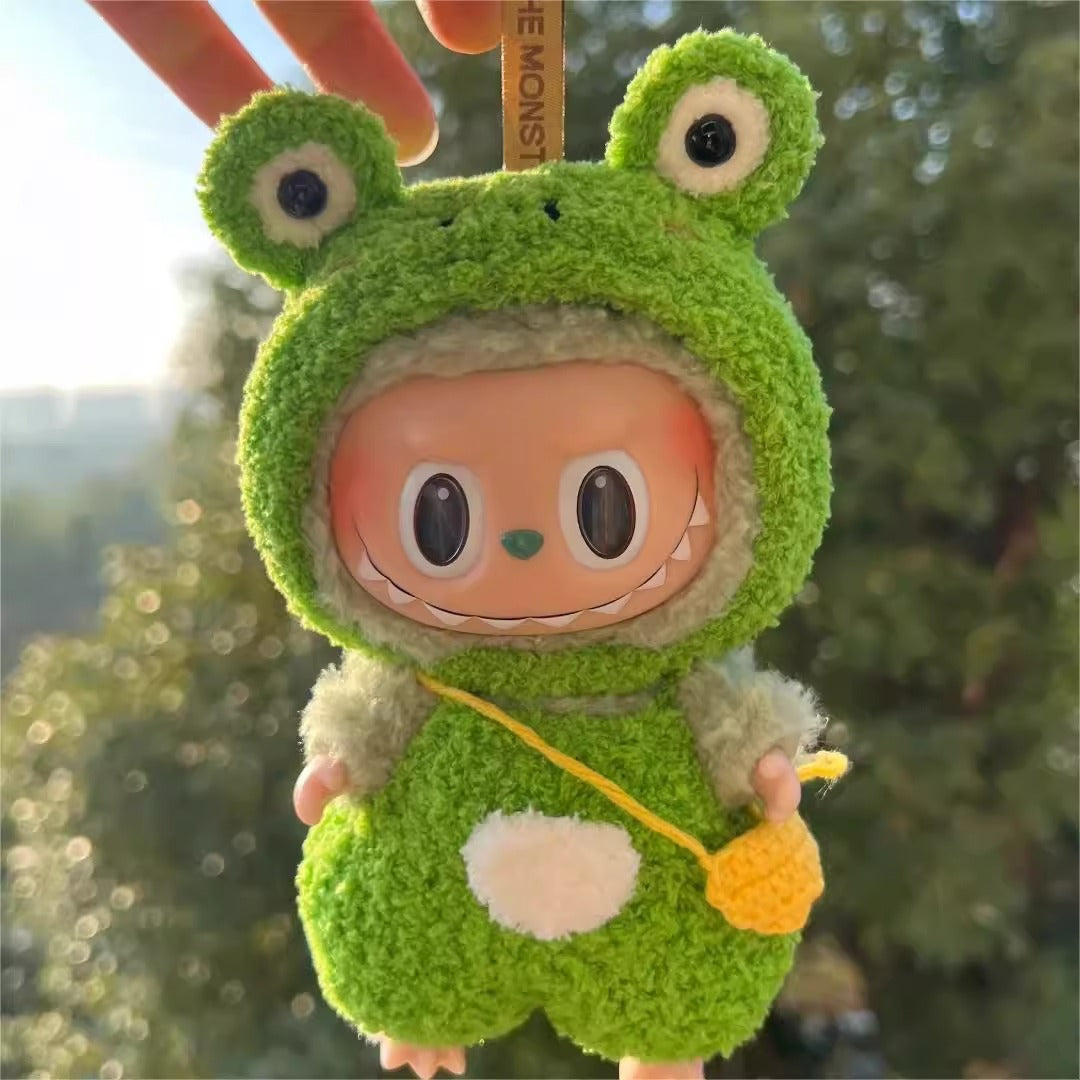 Labubu doll dressed in a handmade Frog outfit with green fleece, white belly and cartoon eyes