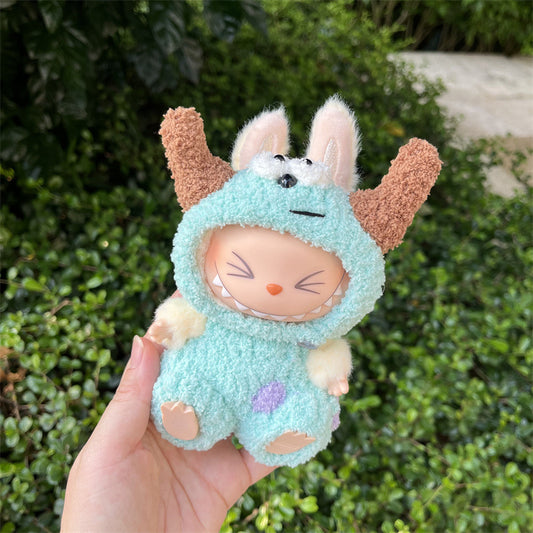 Labubu doll dressed in a handmade Sully outfit with blue fleece, purple spots and plush horns